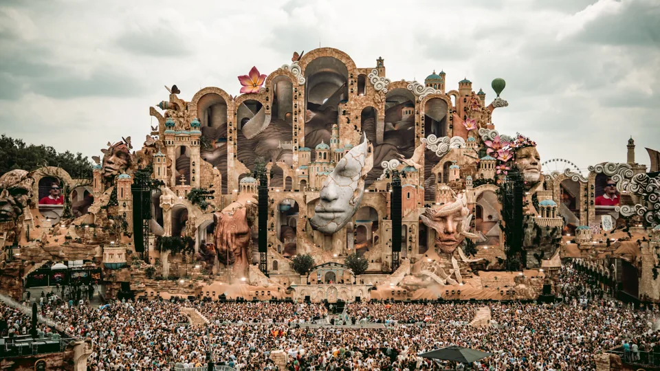 Tomorrowland stage and crowd, illustrating the founder’s experience background